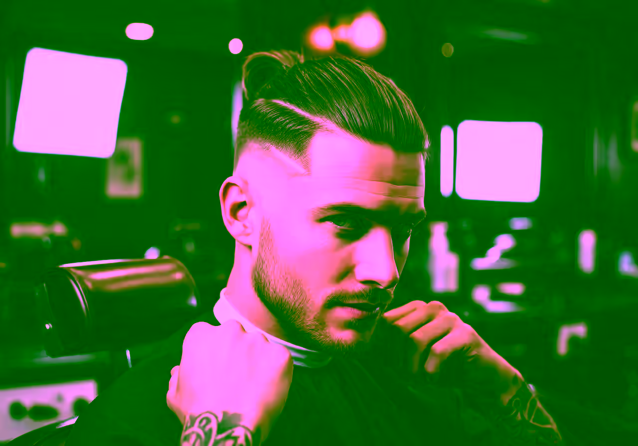 High Taper Fade Man Bun hairstyle for men 2026 — high taper fade variation, best for relaxed cool style + all faces, modern barbering by Master Stylist Jessica Hamilton