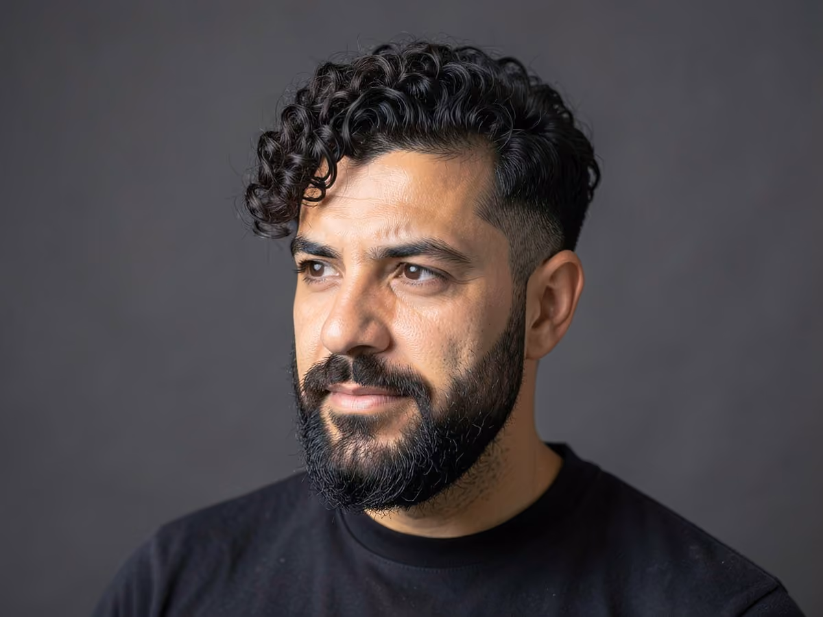Man with a curly hipster haircut
