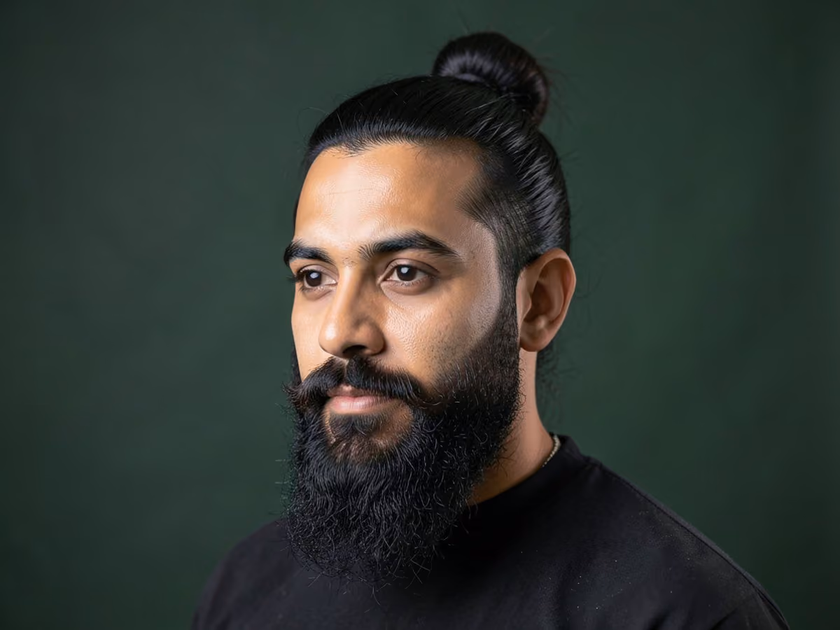Man with a hipster man bun with full beard haircut