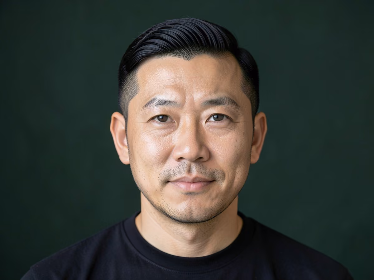 Man with a curved line up haircut