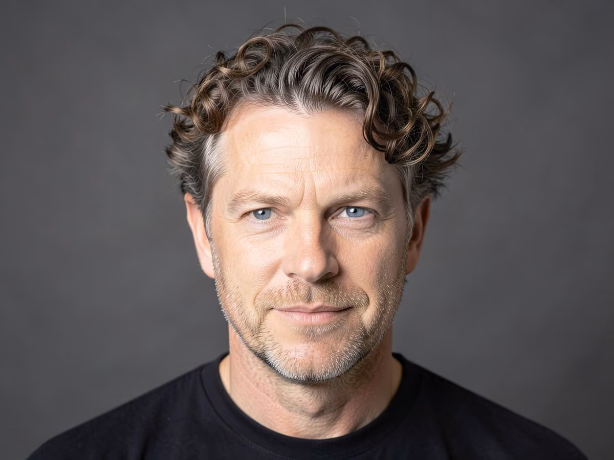 Man with a line up with curls haircut