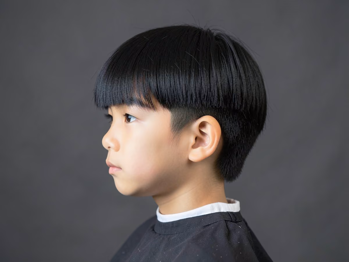 Boy with a boys long bowl cut