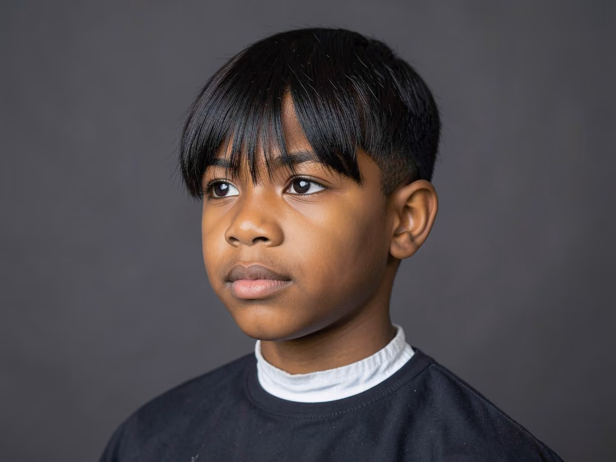 Boy with a boys long fringe haircut