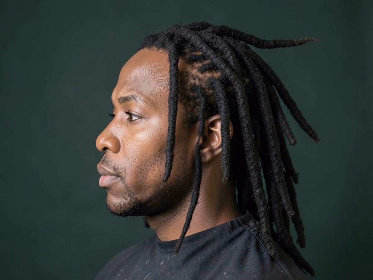 Man with a long freeform locs haircut
