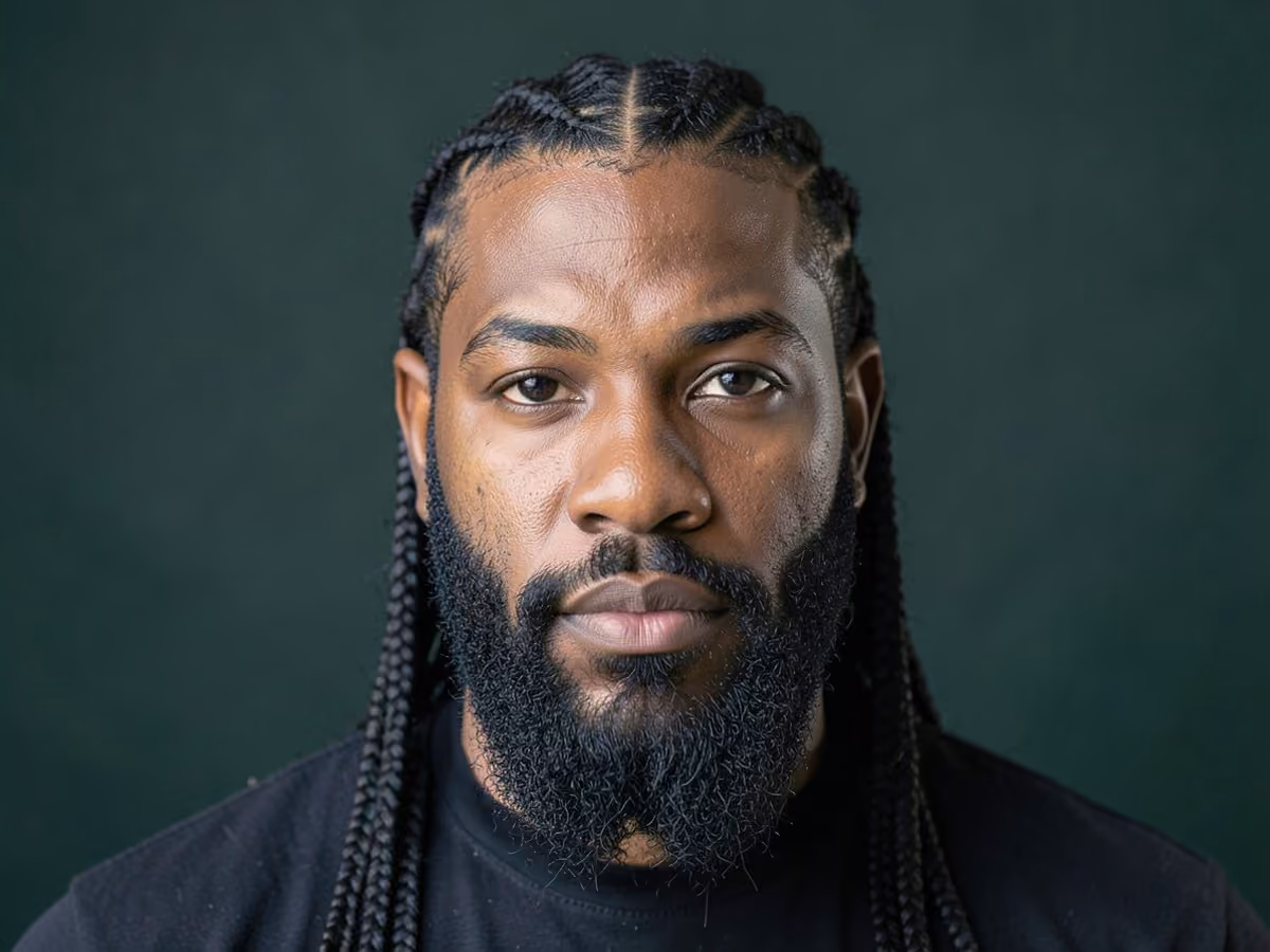 Man with a long stitch braids haircut