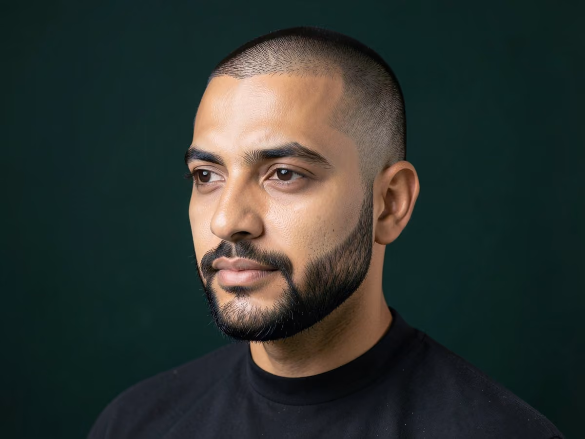 Man with a buzz cut with short boxed beard