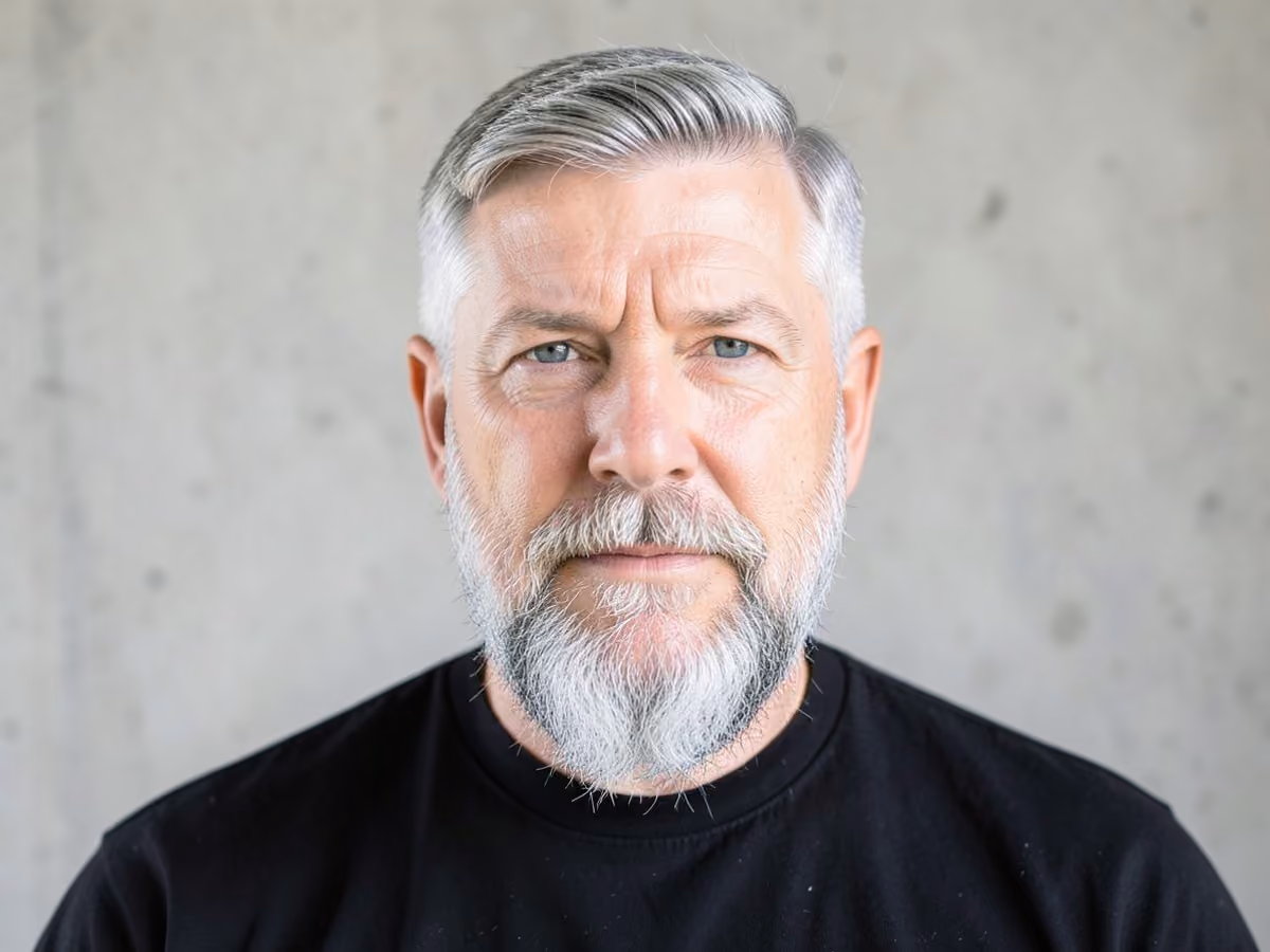 Man with a low maintenance gray haircut