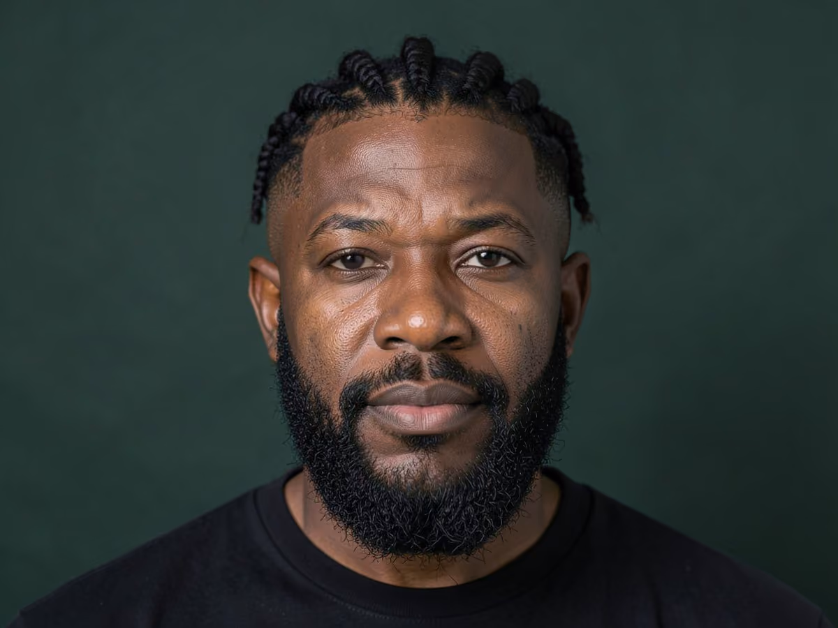 Man with a low skin fade twists
