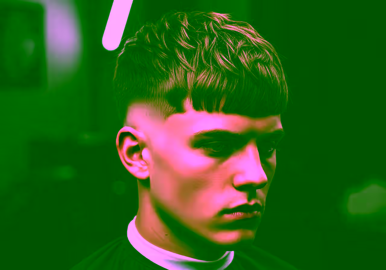 Long Textured Fringe Mid Taper hairstyle for men 2026 — medium taper fade variation, best for teens/young adults, oval/round faces + straight/wavy hair, modern barbering by Master Stylist Jessica Hamilton
