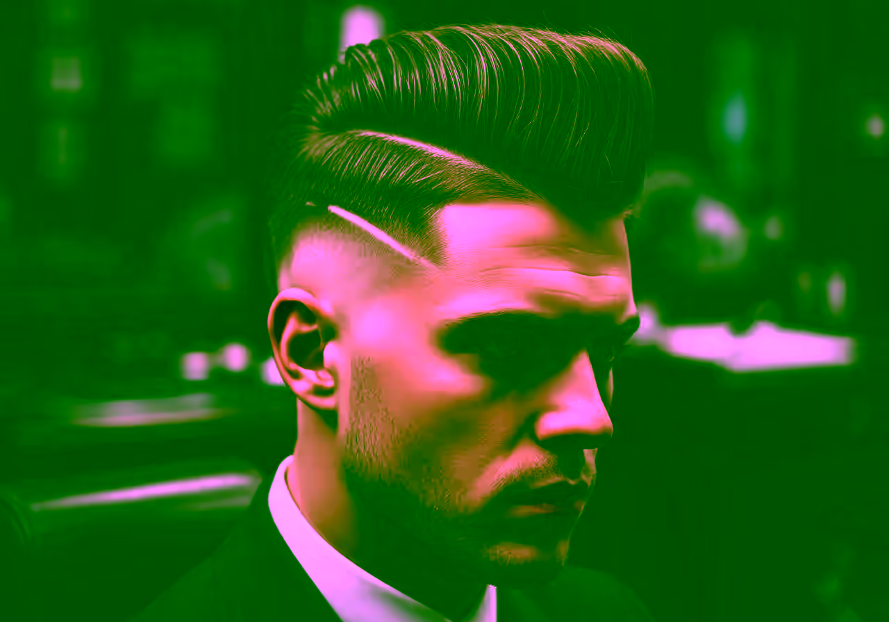 Mid Taper Fade Faux Hawk hairstyle for men 2026 — medium taper fade variation, best for oval/round faces + thick hair, modern barbering by Master Stylist Jessica Hamilton