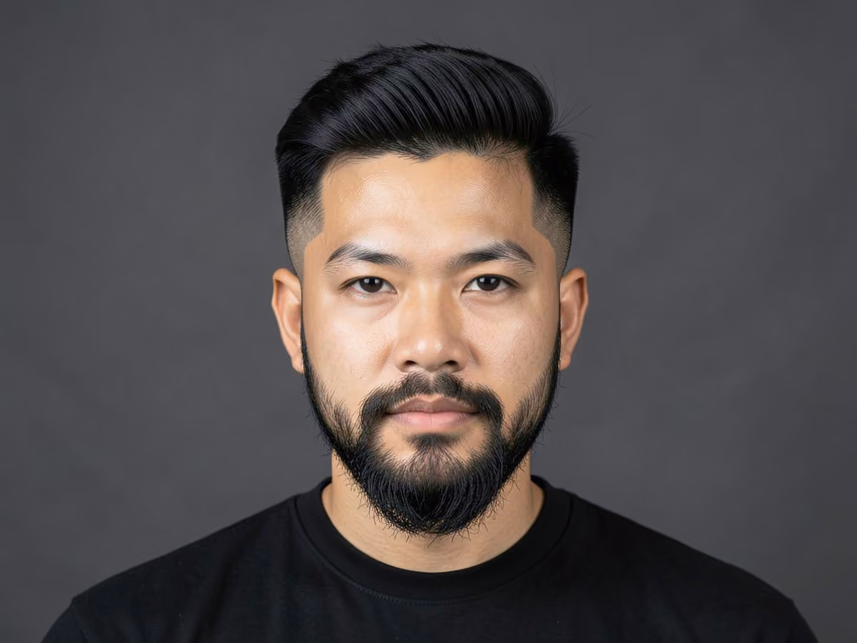 Man with a quiff with low fade