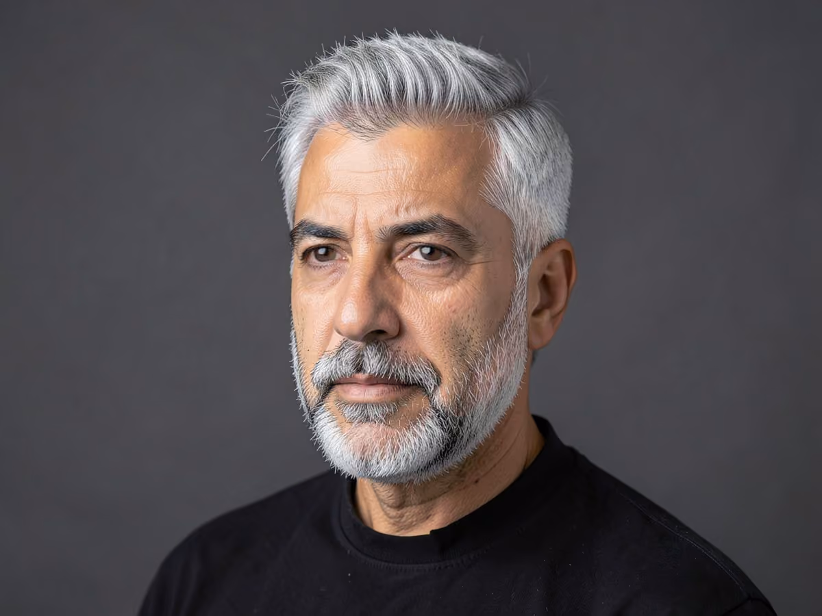 Man with a messy gray hair with beard