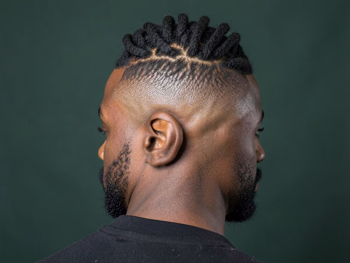 Man with a high fade loc mohawk