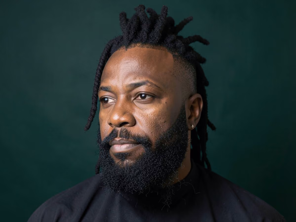 Man with a loc mohawk with beard