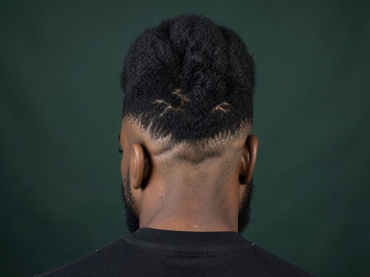 Man with a tall afro mohawk