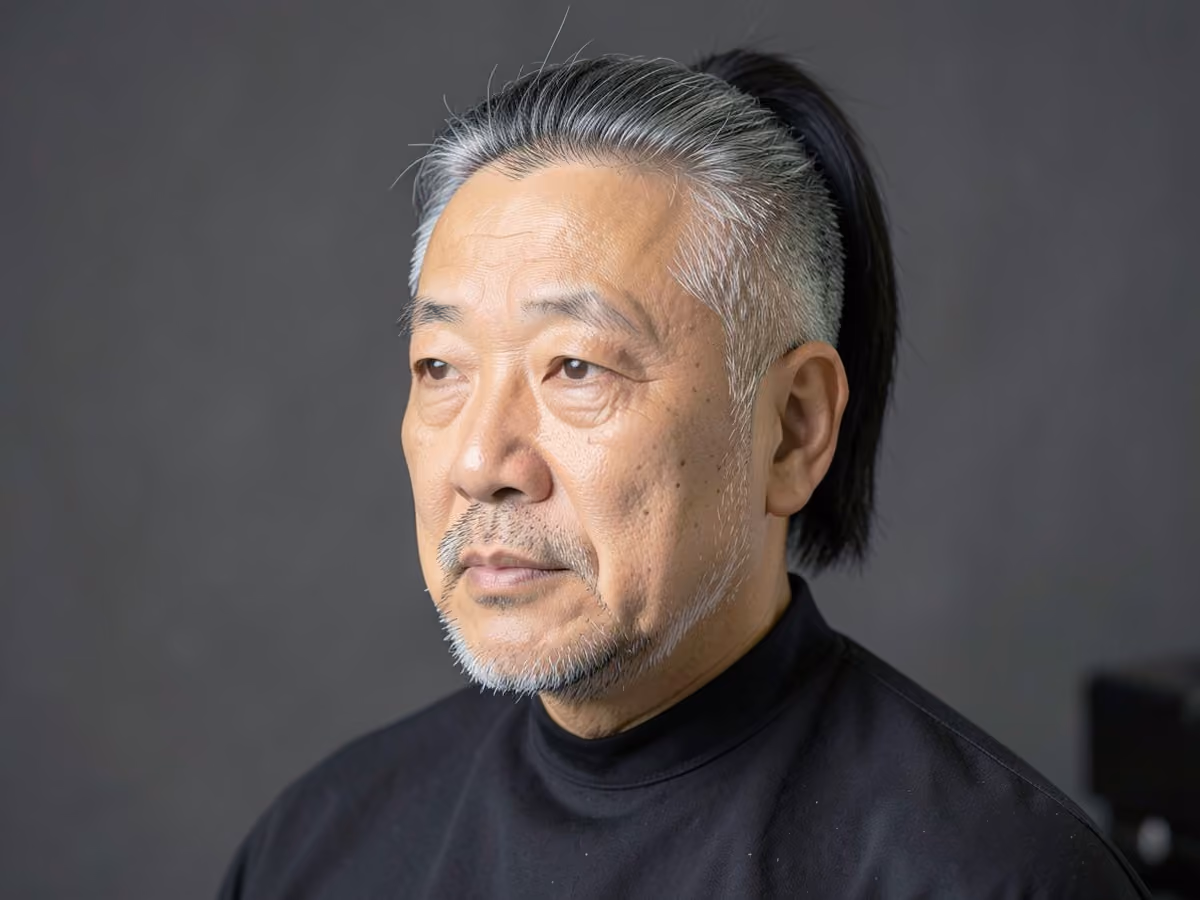 Man with an asian ponytail haircut