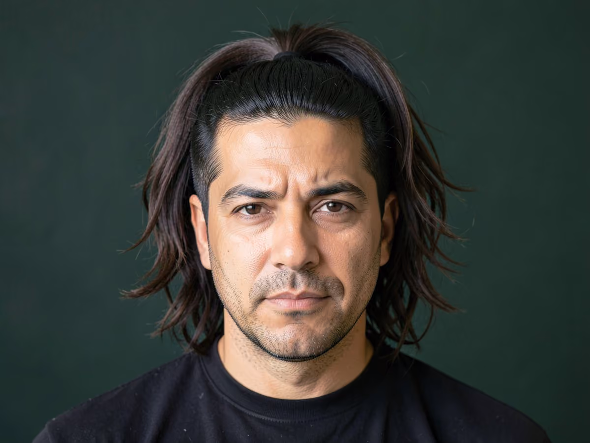 Man with a layered ponytail haircut