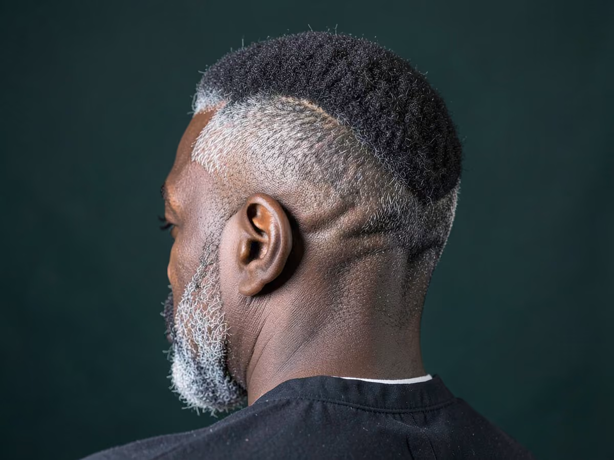 Man with a prom afro with taper haircut