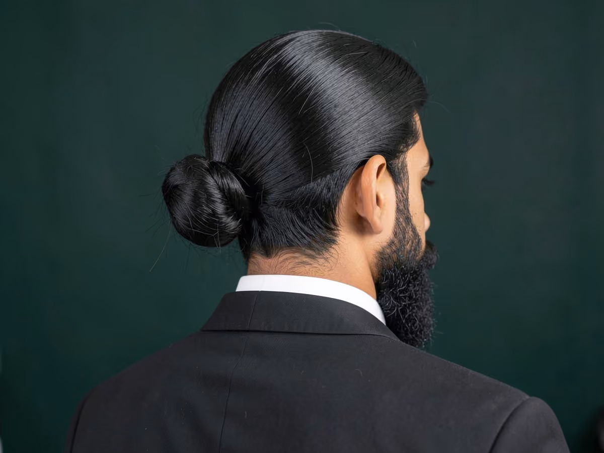 Man with a prom man bun haircut