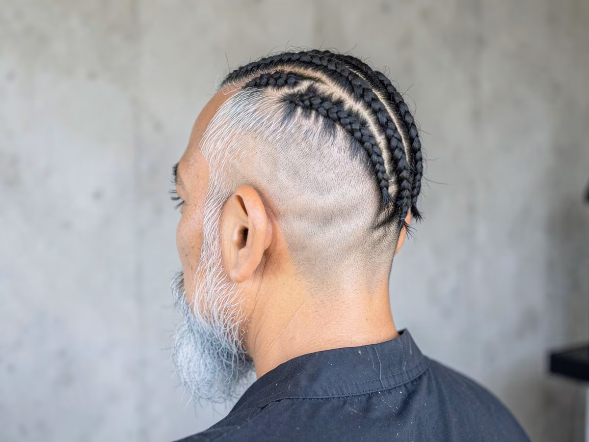 Man with a braids with shaved sides haircut
