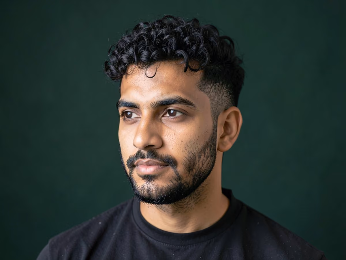 Man with a short curls with stubble haircut