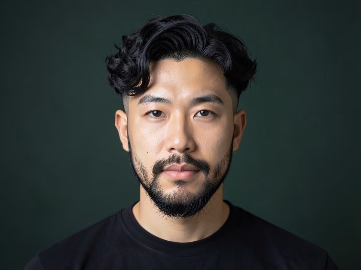 Man with a short curls with undercut