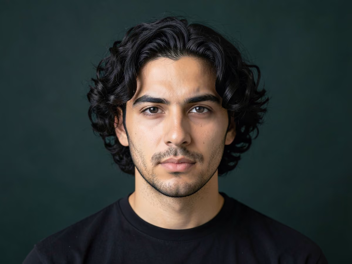 Man with a short loose curls haircut