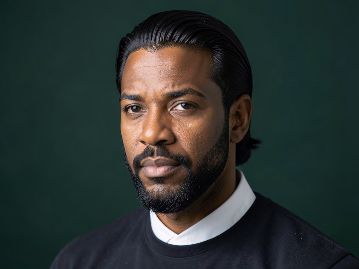 Man with a long top with boxed beard