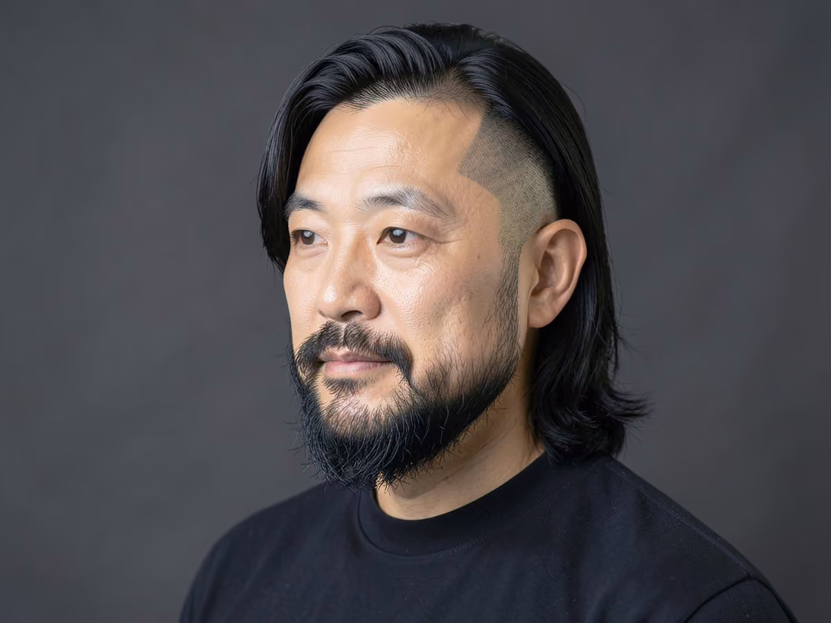 Man with an undercut with tucked long hair