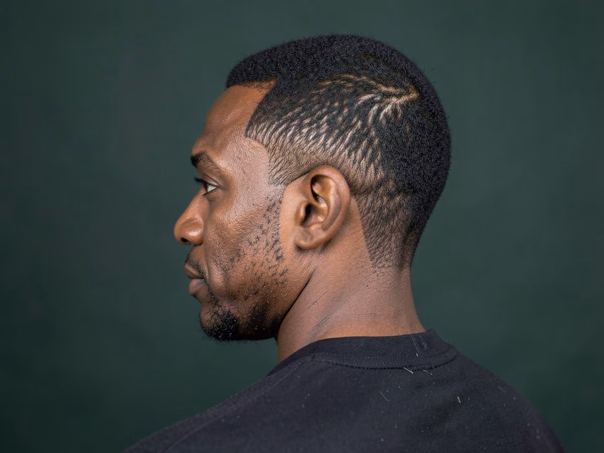Man with a skater hair tucked behind ears