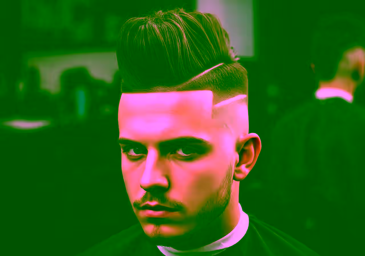 Skin Fade Mohawk hairstyle for men 2026 — skin fade variation, best for oval, round faces + thick hair, modern barbering by Master Stylist Jessica Hamilton