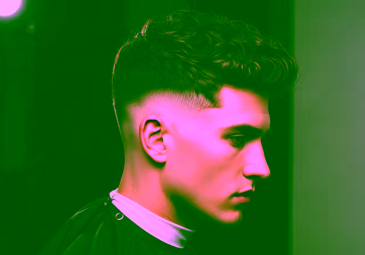 Skin Fade with Thick Curls hairstyle for men 2026 — skin fade variation, best for diamond/heart faces + thick curly hair, modern barbering by Master Stylist Jessica Hamilton
