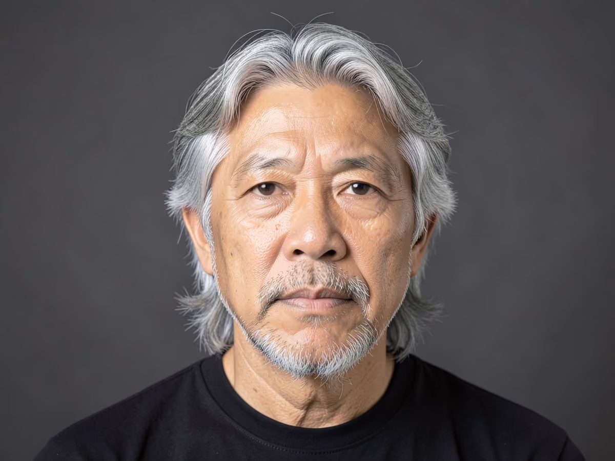 Man with a gray surfer hair