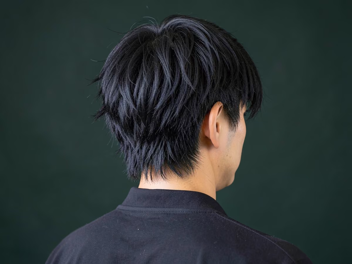 Man with a surfer shag haircut
