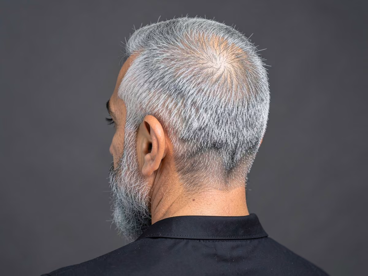 Man with a fine gray hair haircut