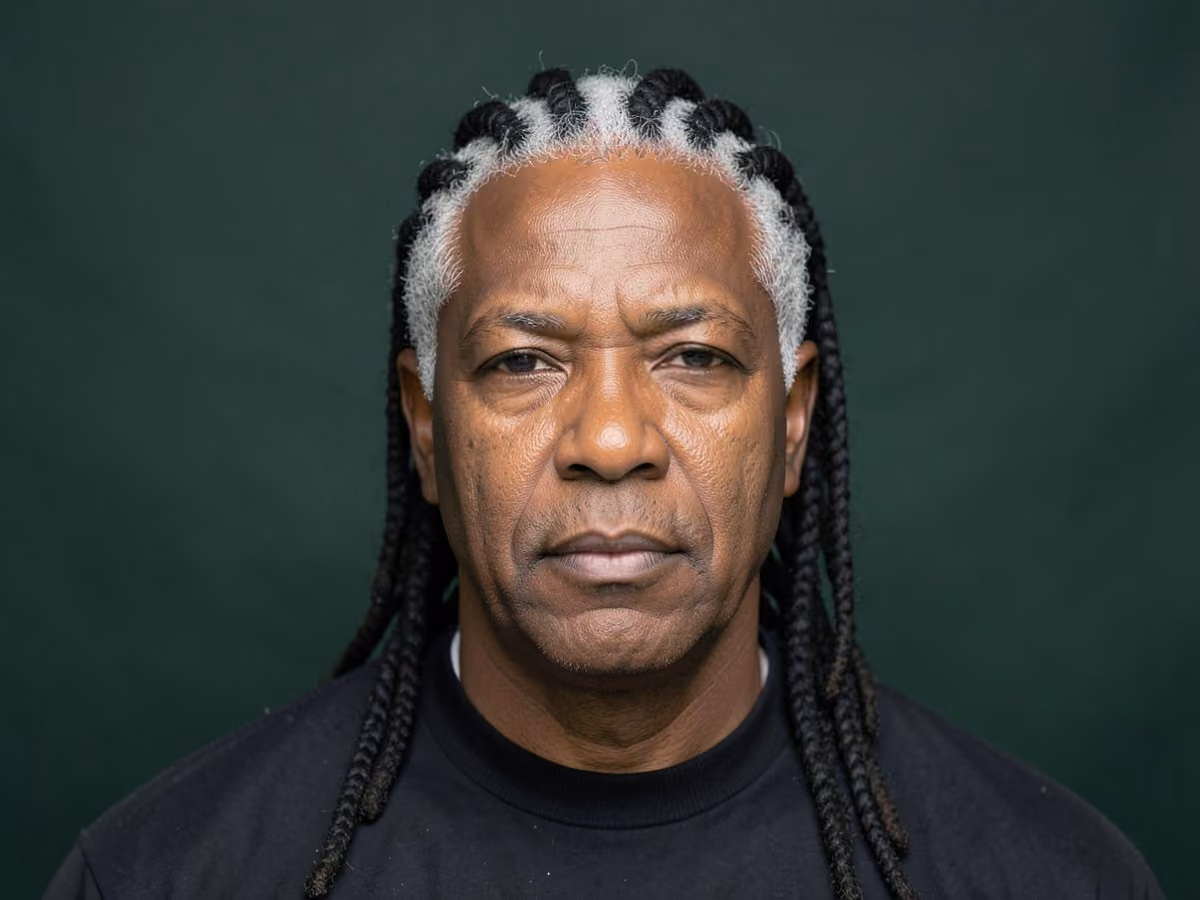 Man with a flat twists to the back