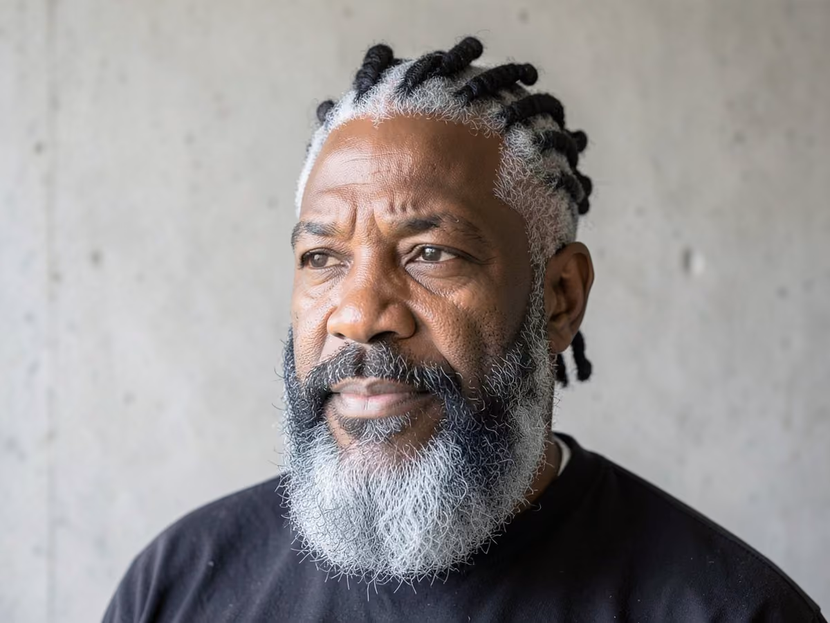 Man with a twists with full beard haircut