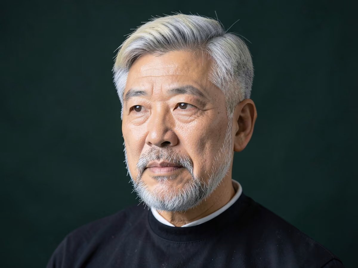 Man with a gray two block haircut