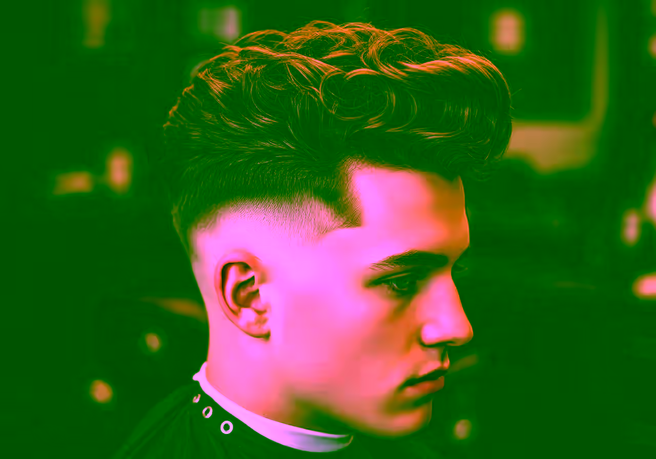Curly Pompadour Undercut hairstyle for men 2026 — undercut variation, best for round faces + curly/coily hair, modern barbering by Master Stylist Jessica Hamilton
