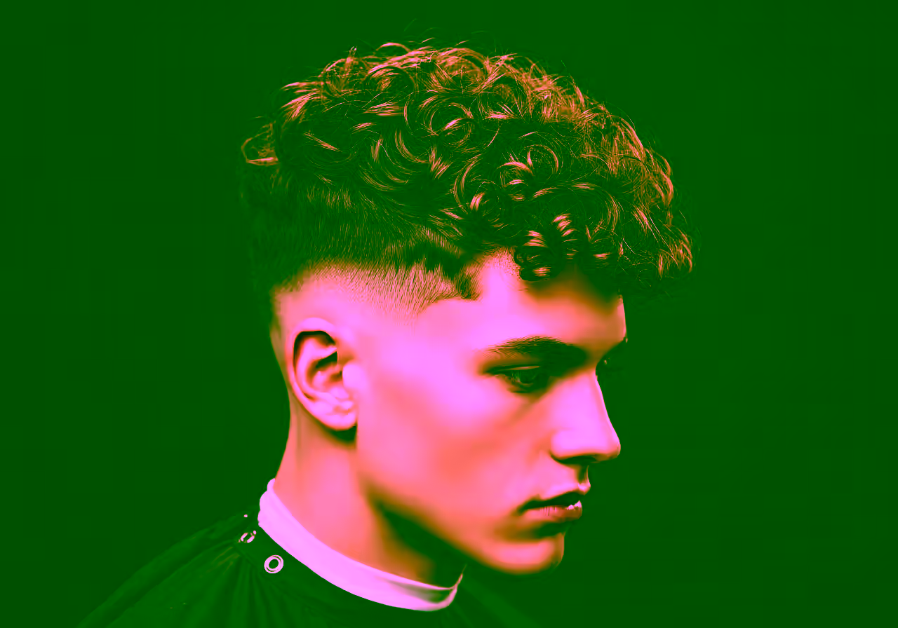 Curly Undercut hairstyle for men 2026 — undercut variation, best for round or oval faces + 3a–4c hair types, modern barbering by Master Stylist Jessica Hamilton
