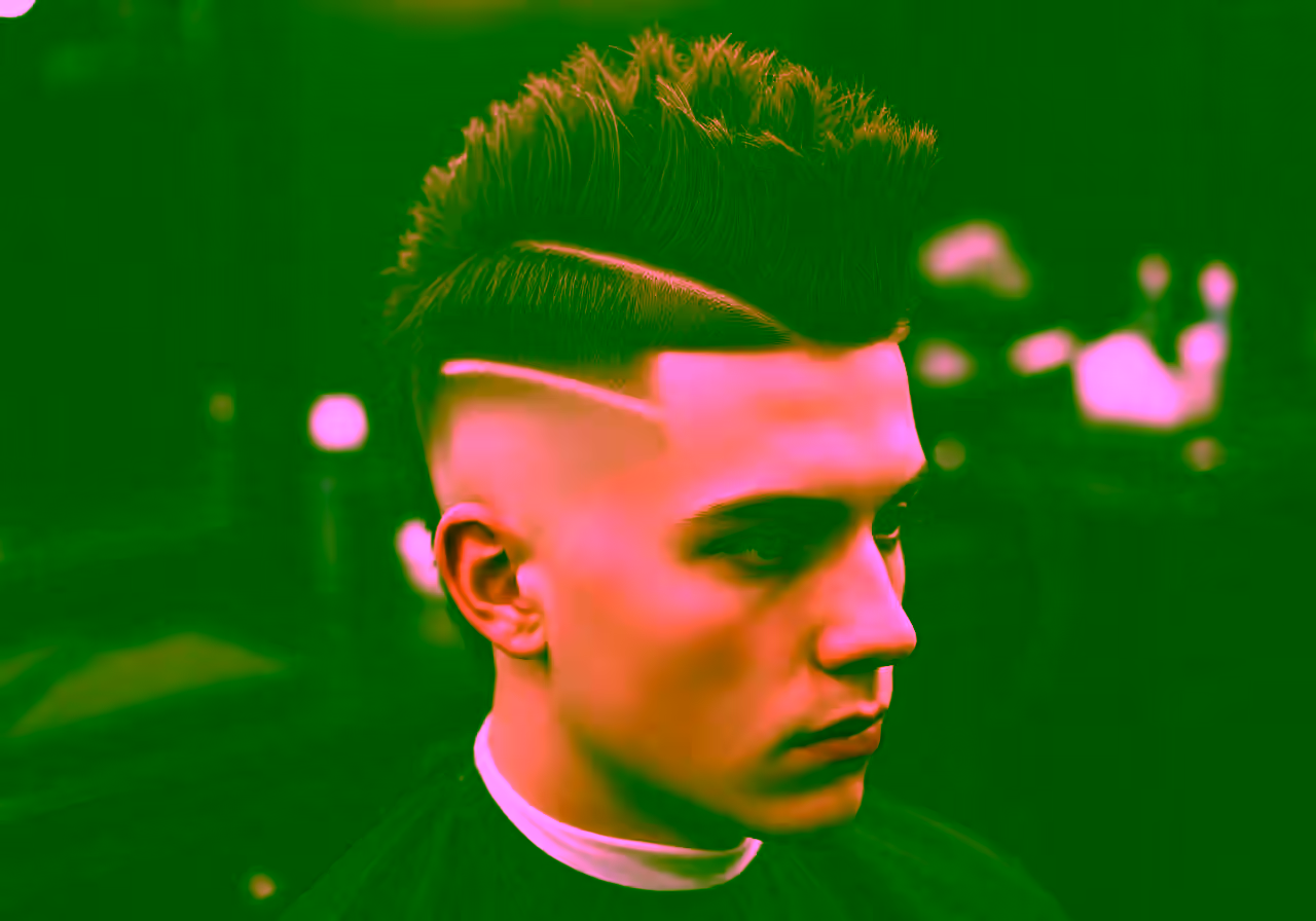 Faux Hawk / Mohawk Undercut hairstyle for men 2026 — undercut variation, best for bold personalities + oval faces, modern barbering by Master Stylist Jessica Hamilton