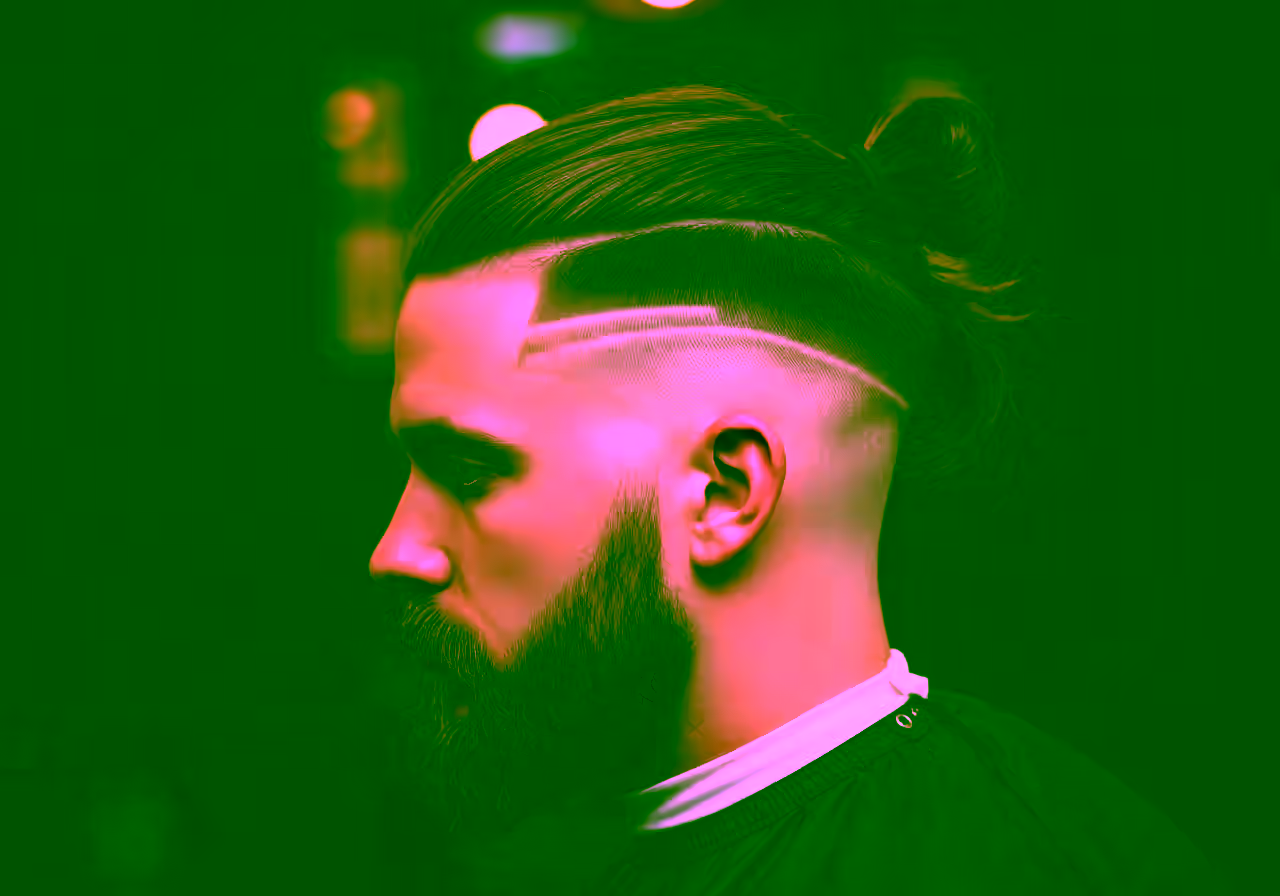 Man Bun / Long Top Undercut hairstyle for men 2026 — undercut variation, best for thick hair + casual or bohemian style, modern barbering by Master Stylist Jessica Hamilton