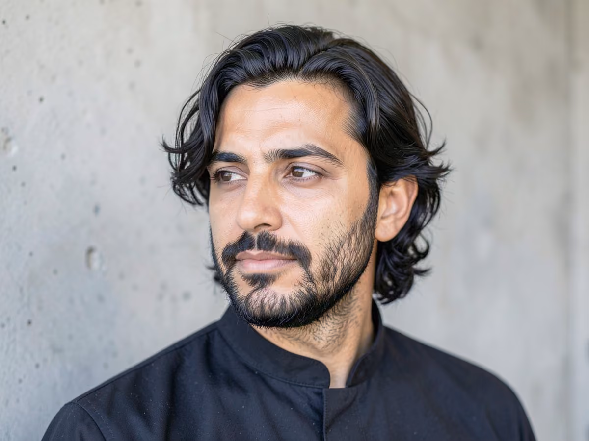 Man with a medium length wavy hair