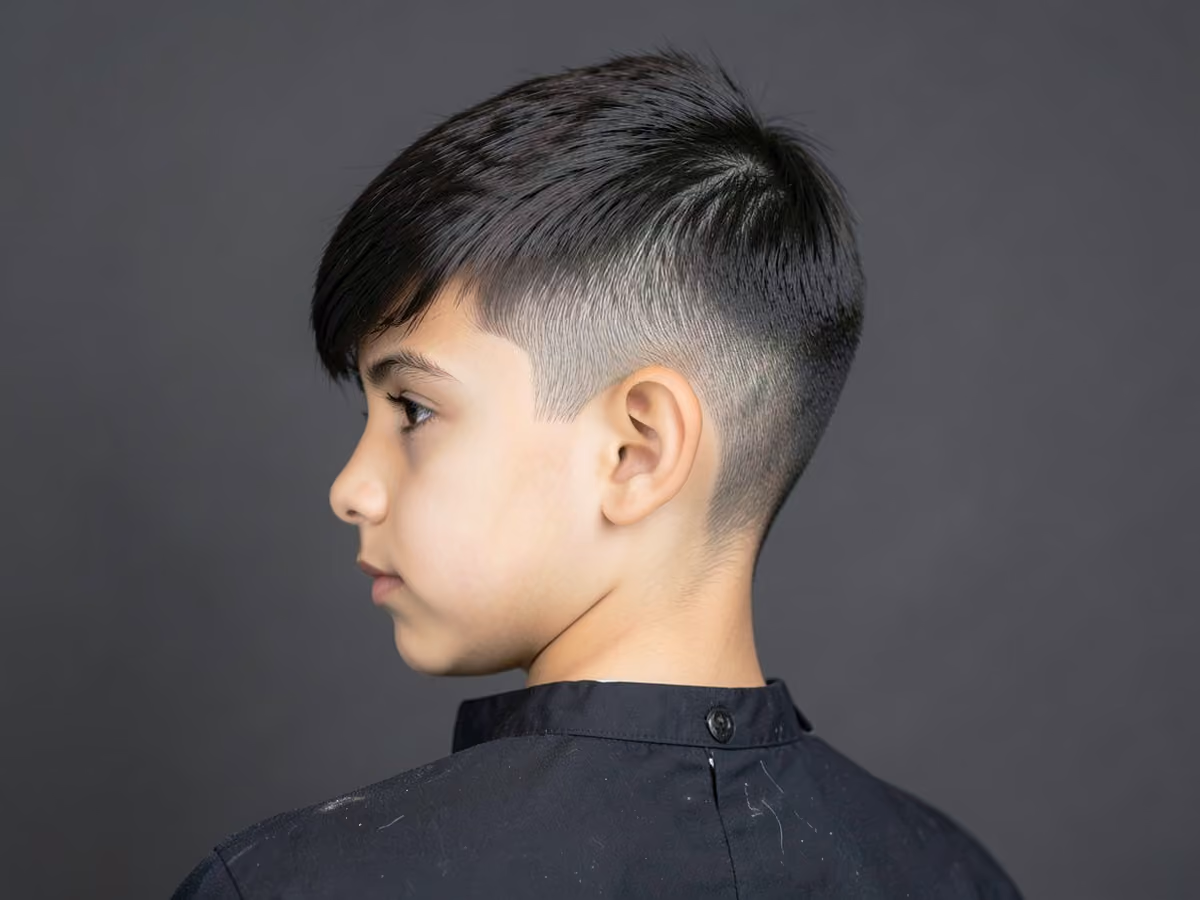 Boy with a side swept fringe taper haircut