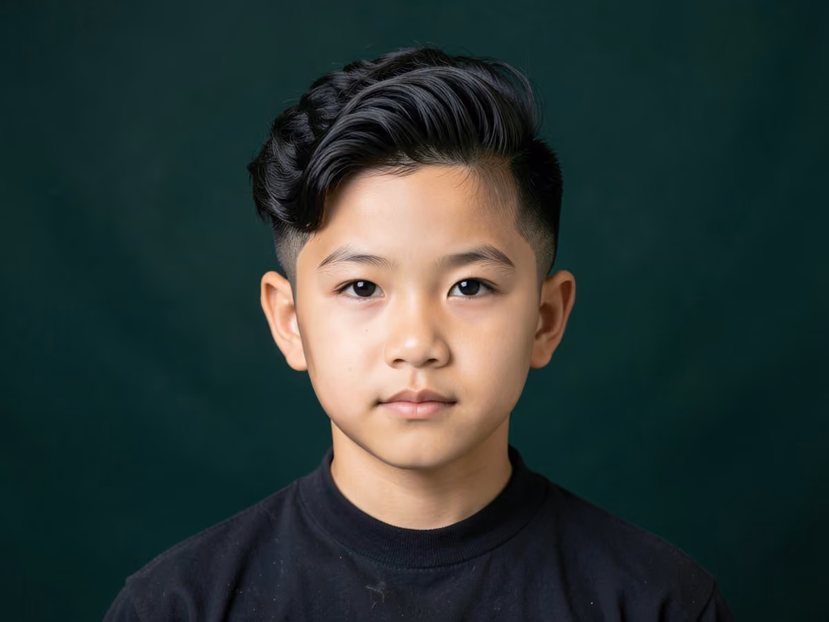 Boy with a wavy quiff taper
